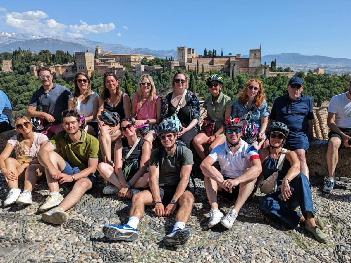 Corporate team building group activity in Andalusia with participants collaborating outdoors
